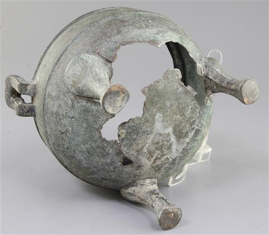 A Chinese archaic bronze tripod ritual food vessel, Ding, Eastern Zhou dynasty, 26.5cm wide, holes to base, cover lacking